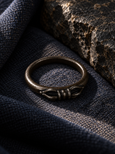Load image into Gallery viewer, The Unbroken Tibetan Dorje ring presented as a collectible object.