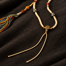 Load image into Gallery viewer, The Mark of Time pendant cord necklace with central bead — image 07