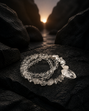 Load image into Gallery viewer, NORBU OBJECTS product image direction: a neck-worn line with a central pendant or focal detail; clear and translucent tones; deep highland light; a map archivist in a quiet Lhasa guesthouse; collector archive.
