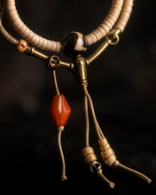 Load image into Gallery viewer, A Quiet Return beaded bracelet with pale beads and warm orange accent — image 08
