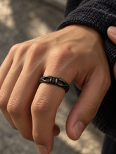 Load image into Gallery viewer, The Unbroken ring shown in a hand gesture in an editorial scene.

