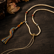 Load image into Gallery viewer, The Mark of Time pendant cord necklace with central bead — image 01
